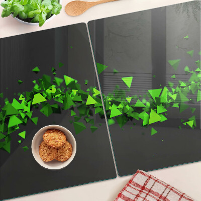 Glass kitchen board Green triangles on a black background