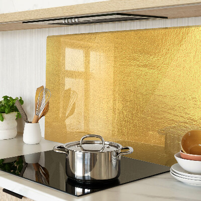 Chopping board glass Golden surface with reflections