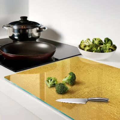 Chopping board glass Golden surface with reflections