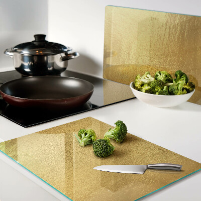 Chopping board glass Golden surface with reflections