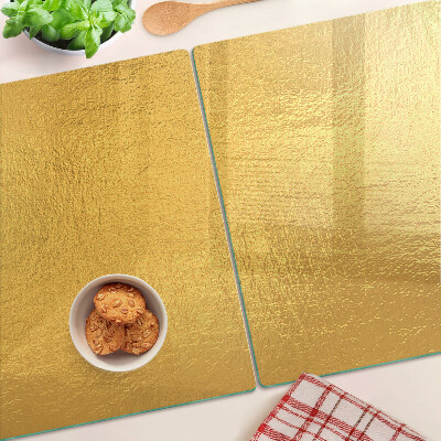 Chopping board glass Golden surface with reflections