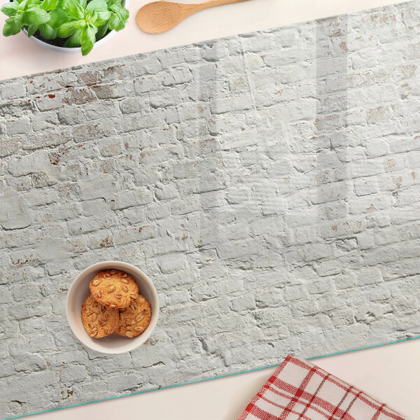 Glass chopping board Brick wall in loft style