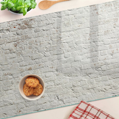 Glass chopping board Brick wall in loft style