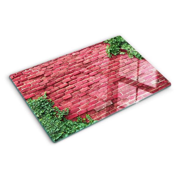 Glass chopping board Brick wall with vegetation