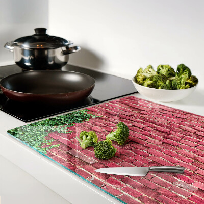 Glass chopping board Brick wall with vegetation