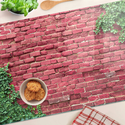 Glass chopping board Brick wall with vegetation
