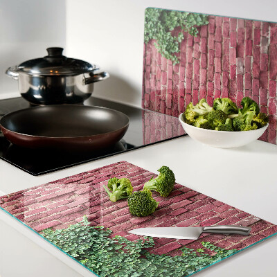 Glass chopping board Brick wall with vegetation
