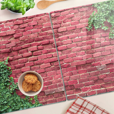Glass chopping board Brick wall with vegetation