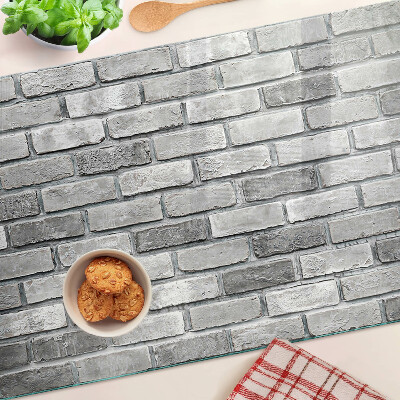 Glass kitchen board Brick wall in shades of gray