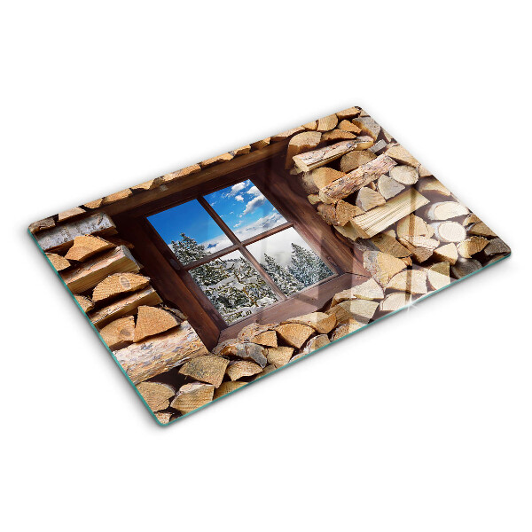 Chopping board glass View of a winter landscape through the window