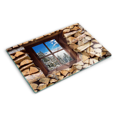 Chopping board glass View of a winter landscape through the window