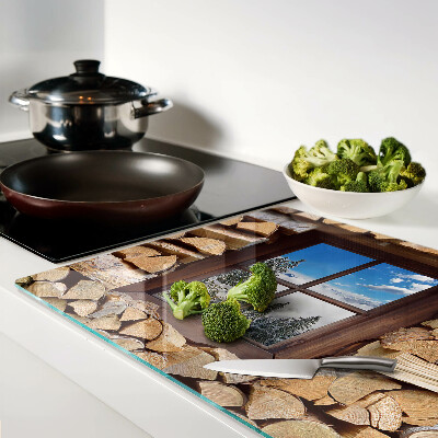 Chopping board glass View of a winter landscape through the window