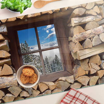 Chopping board glass View of a winter landscape through the window