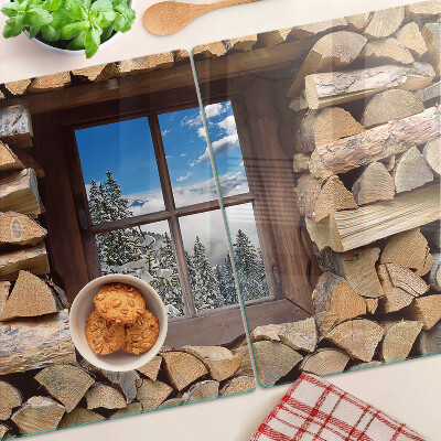 Chopping board glass View of a winter landscape through the window