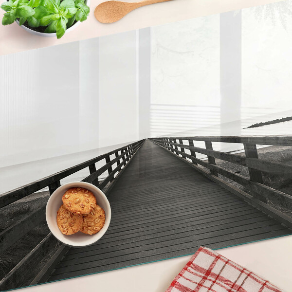 Glass kitchen board Wooden bridge over the water