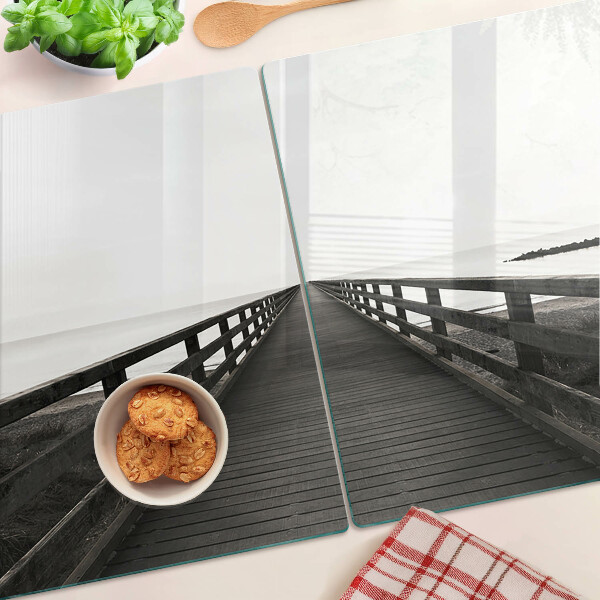 Glass kitchen board Wooden bridge over the water