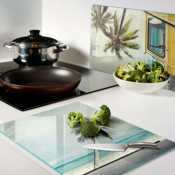 Glass cutting board Beach with palm trees and a car