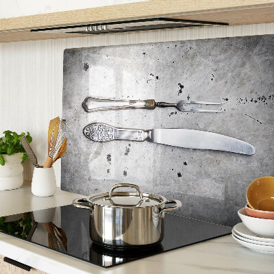 Glass kitchen board Cutlery on a concrete background