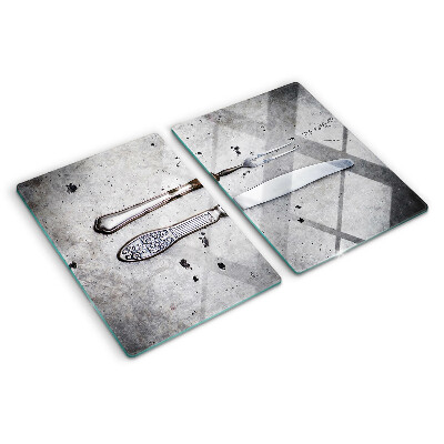 Glass kitchen board Cutlery on a concrete background