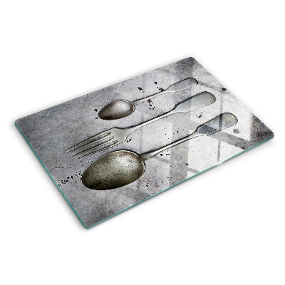 Chopping board Cutlery on a concrete background