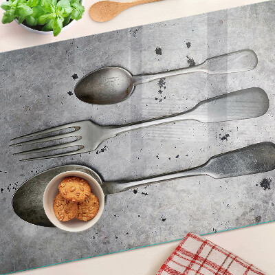 Chopping board Cutlery on a concrete background