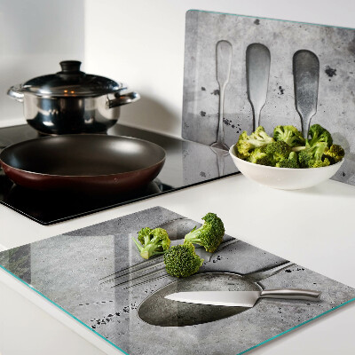 Chopping board Cutlery on a concrete background