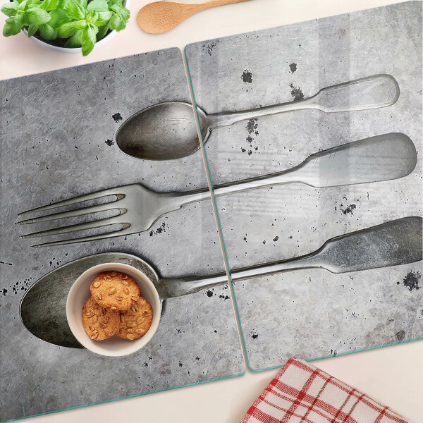 Chopping board Cutlery on a concrete background