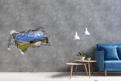 Hole in the wall sticker Mountain landscape behind the hole in the wall