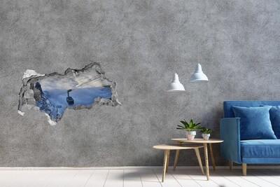 Hole wall sticker Mountain cable car above the clouds
