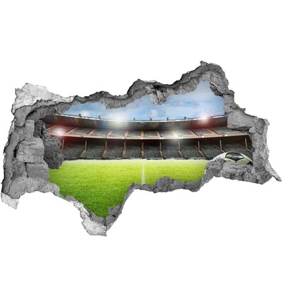 Hole wall sticker Football stadium from behind the wall