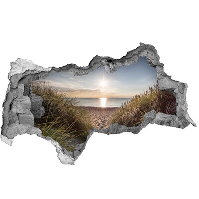 Hole in the wall sticker Sunset over the beach