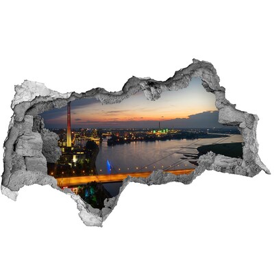 Hole wall sticker View of the city at sunset