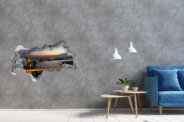 Hole wall sticker View of the city at sunset