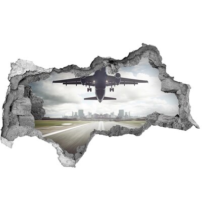 Hole in the wall sticker Plane landing in the city