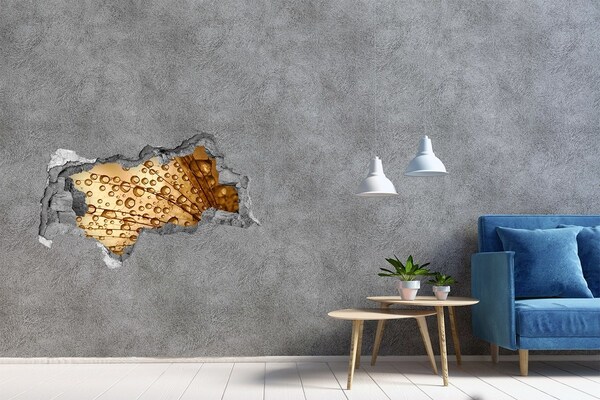 Hole in the wall decal A golden drop on the concrete background