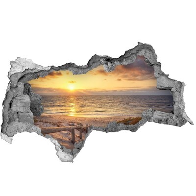 Hole in the wall sticker Sunset over the beach