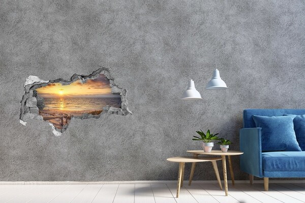 Hole in the wall sticker Sunset over the beach