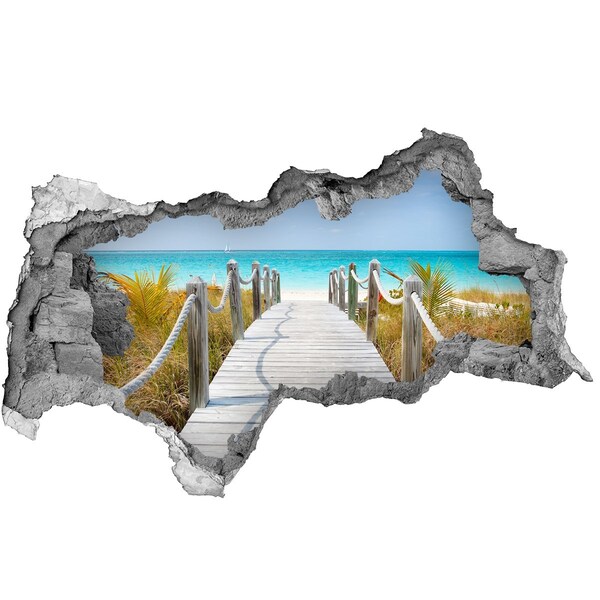 Hole in the wall sticker Tropical beach with a wooden pier