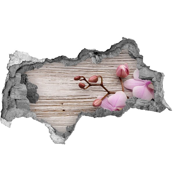 Hole in the wall sticker Orchid flowers on a wooden background