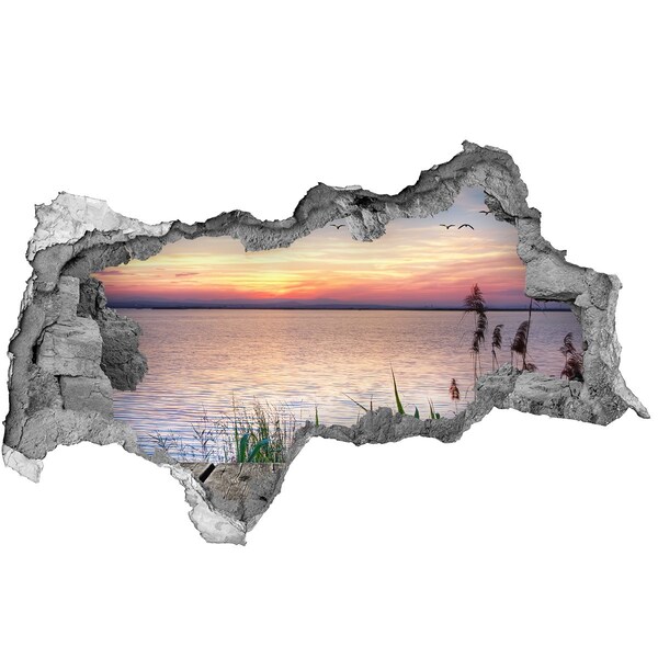 Hole wall sticker Sunset over the lake