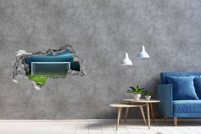 Hole wall sticker The football stadium behind the hole in the wall