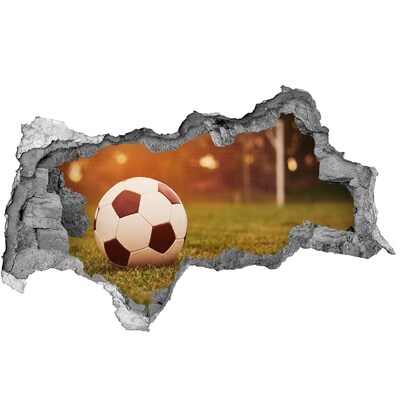 Hole wall sticker Football on the pitch