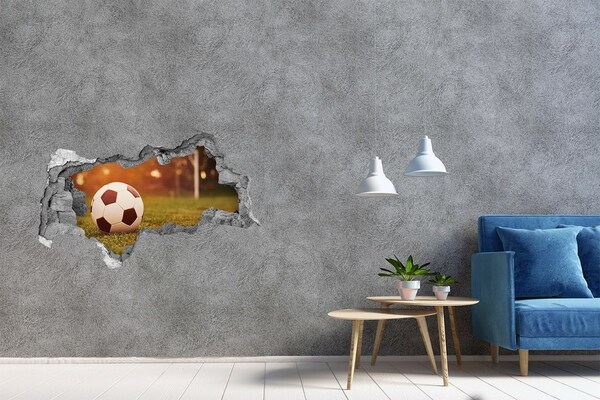 Hole wall sticker Football on the pitch