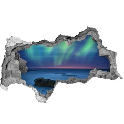 Hole wall sticker Aurora Borealis over the ocean