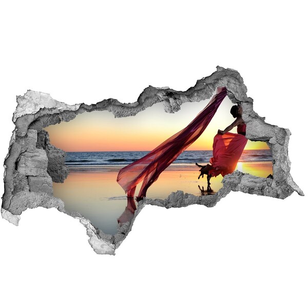 Hole wall sticker Dancing on the beach at sunset