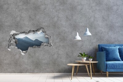 Hole in the wall sticker Mountain landscape through a hole in the wall