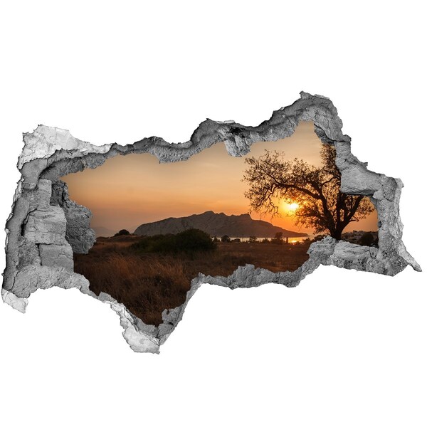 Hole wall sticker Sunset over a mountain landscape