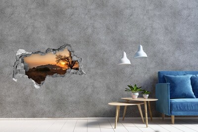 Hole wall sticker Sunset over a mountain landscape