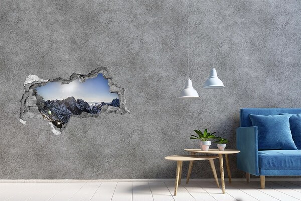 Hole in the wall sticker Mountain landscape with sun rays