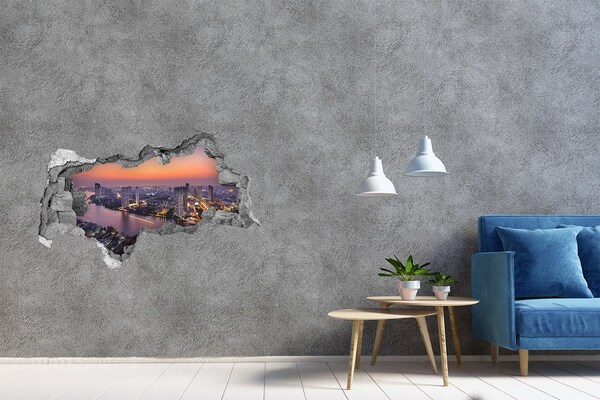 Hole wall sticker View of the city at sunset